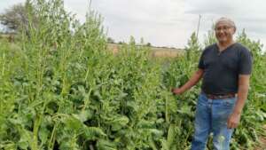 Jacinto proudly shows his crops