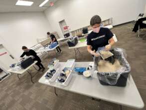 GlobalMedic volunteers packing McAntony's Menu