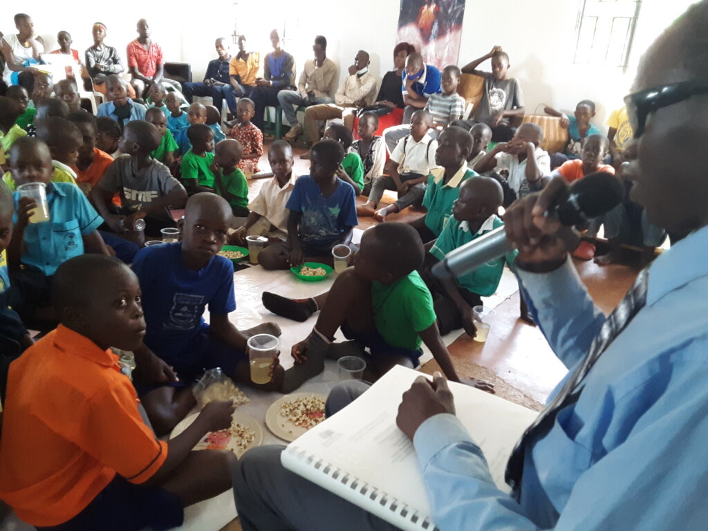 Visually impaired youth Dan reading for students