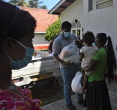 A mother and daughter receive goods for their home