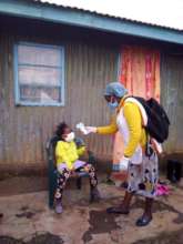 Lucy doing C19 screening door to door in the slum