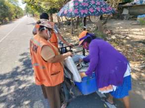 Volunteers check to ensure safety guidelines