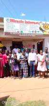 STUDENTS POSE IN-FRONT OF THE CENTRE
