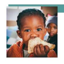 Child with a sandwich received from Love Story