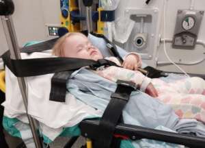 Esme in an ambulance on the way to hospital