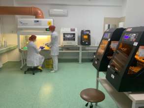 Geneticians working on the equipment
