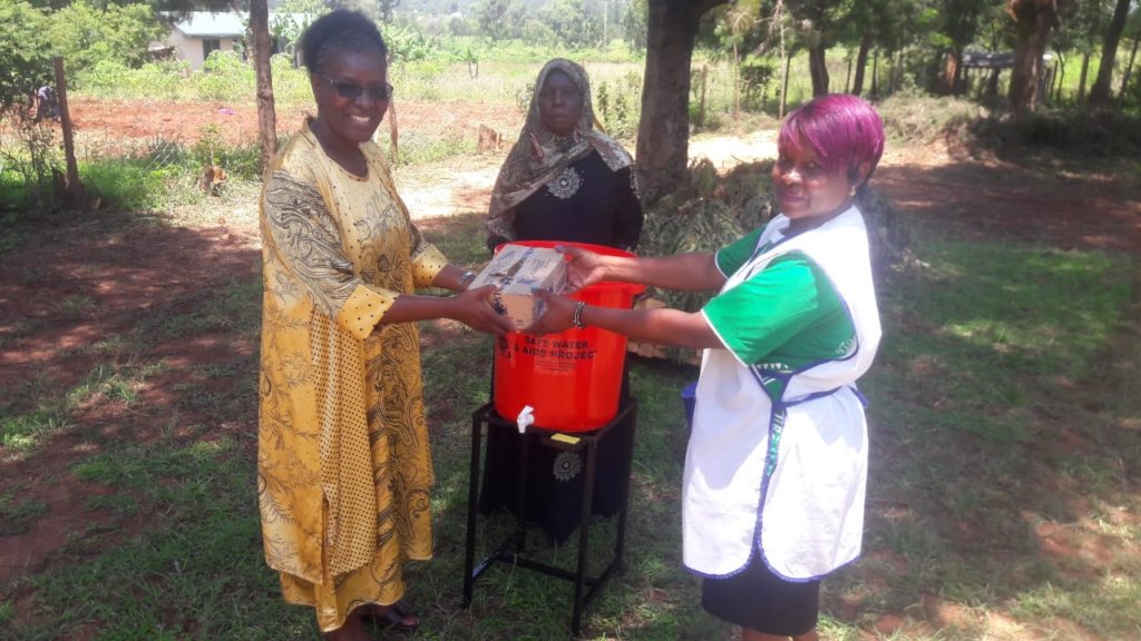 Handing over of soap and hand washing station