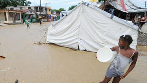 Rain from Hurricane Tomas floods a tent in Haiti