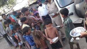Policemen distributing the ISKCON Food Packets