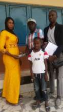 Abdoulie less fortunate child with teacher