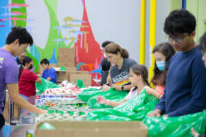 Volunteers sorting food for distribution