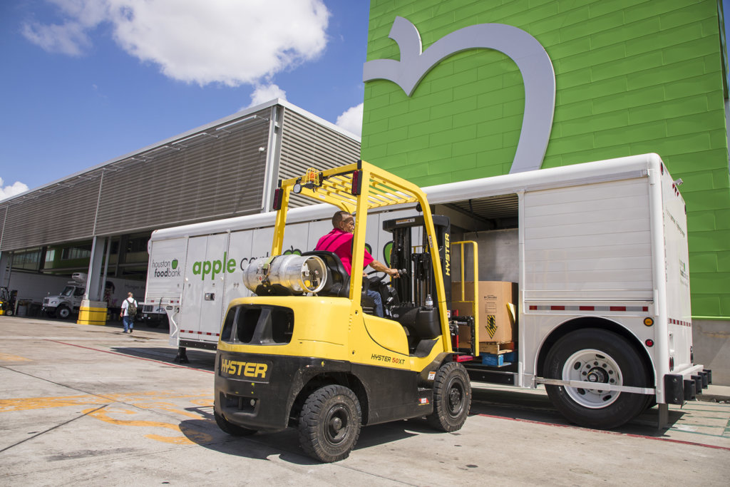 HFB employee loads mobile pantry for distribution.