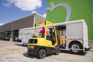 HFB employee loads mobile pantry for distribution.