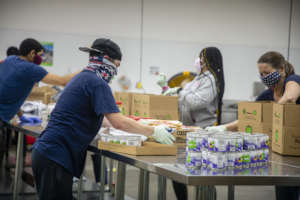 Volunteers assembling food boxes