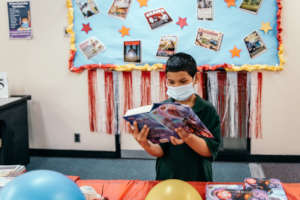 A student considers which books to select