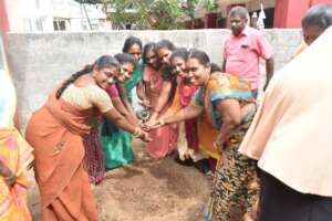 Women planting seed and starting the activity