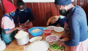 Class 4 having a practical lesson about vegetables