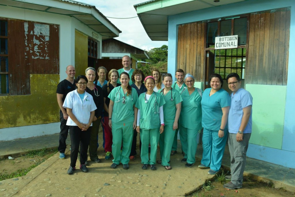 Medical Team Next to Clinic Building