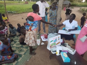 Beatrice giving malaria meds after testing - July
