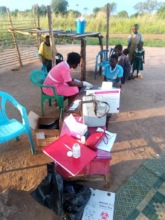 Nurse Macrena testing for malaria in villages
