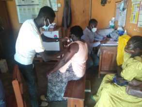 Agwata community members getting vaccine shots