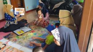 A volunteer health worker explaining Stunting