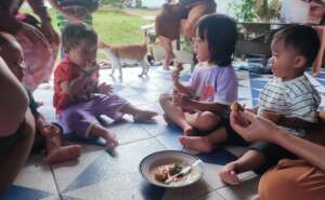 Children testing the food after a cooking class