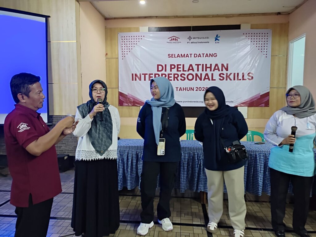 Participants ask questions during the training