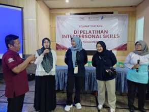 Participants ask questions during the training
