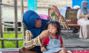 Mother feeding her child