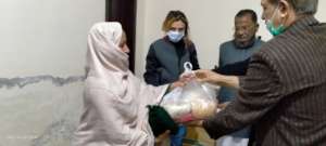 Ration being Distributed to a Poor Women
