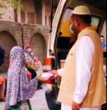 A small Girl Receiving Iftar Box