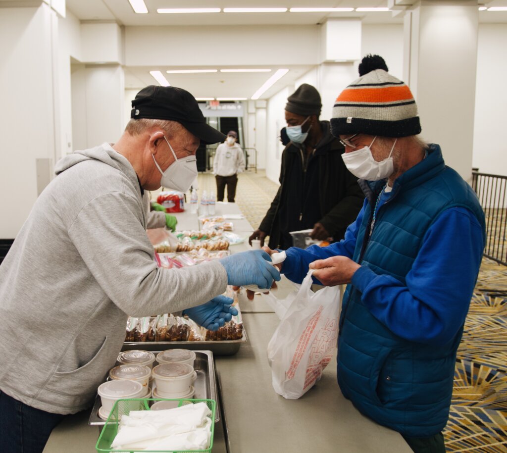 Volunteers serve hot meals at Huntington Place