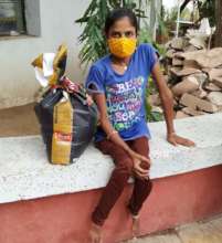 Girl with Disabilities receiving kit