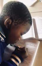 A student doing her homework during homework club