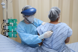Professional and patient wearing PPE