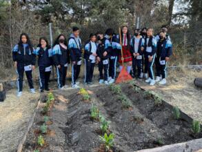Students working at the school garden