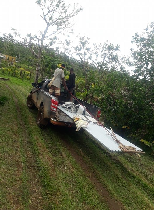 transport of the corrugated iron to the village