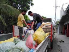 Local working partners arranging supplies
