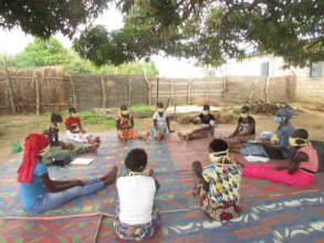 Telling stories and giving advice under the tree
