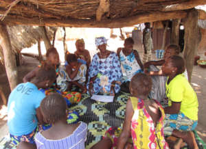 Grandmother discusses with adolescent girls