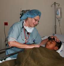 A doctor comforts her patient