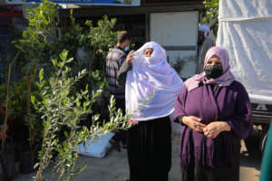 Mrs. Najah and a beneficiary from another family