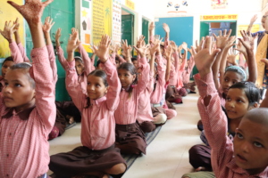 Children are showing their hands during workshop