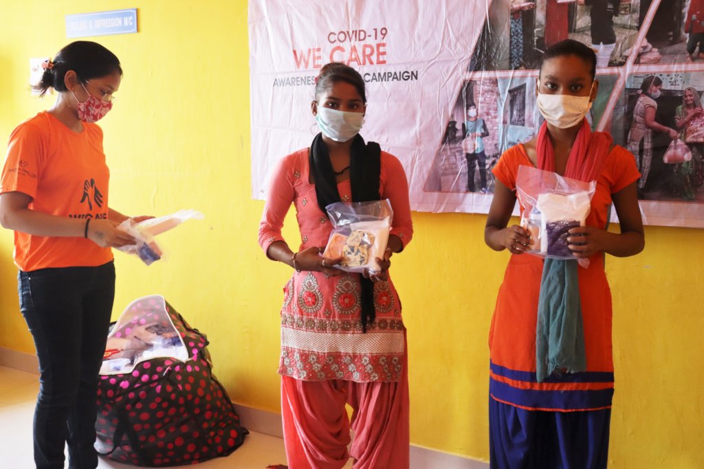 Girls with hygiene kits