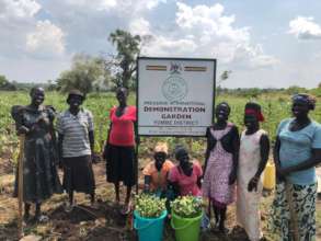 Women with garden sign