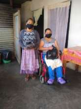 Recently widowed woman receiving pantry supplies