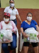 Women from the community receiving donations