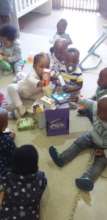 Toddlers exploring recycled materials
