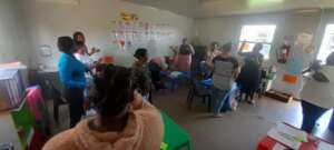 Teachers in small groups at workshop